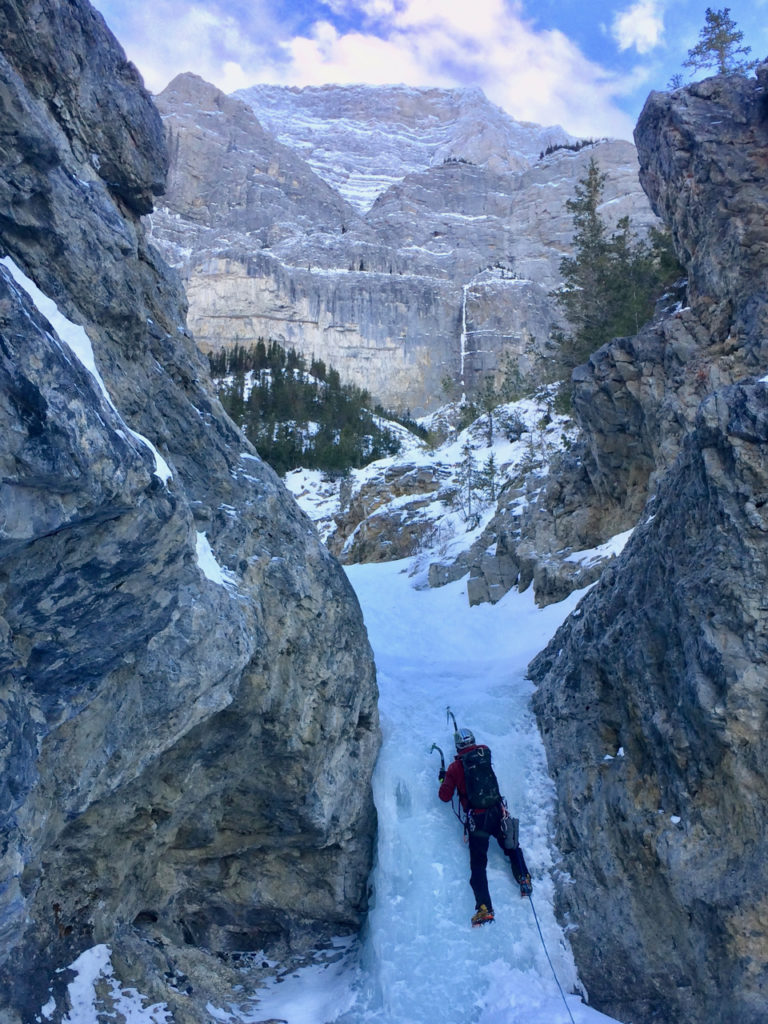 One of the easier pitches on Professor Falls with the walls of Mt. Rundle looming above.